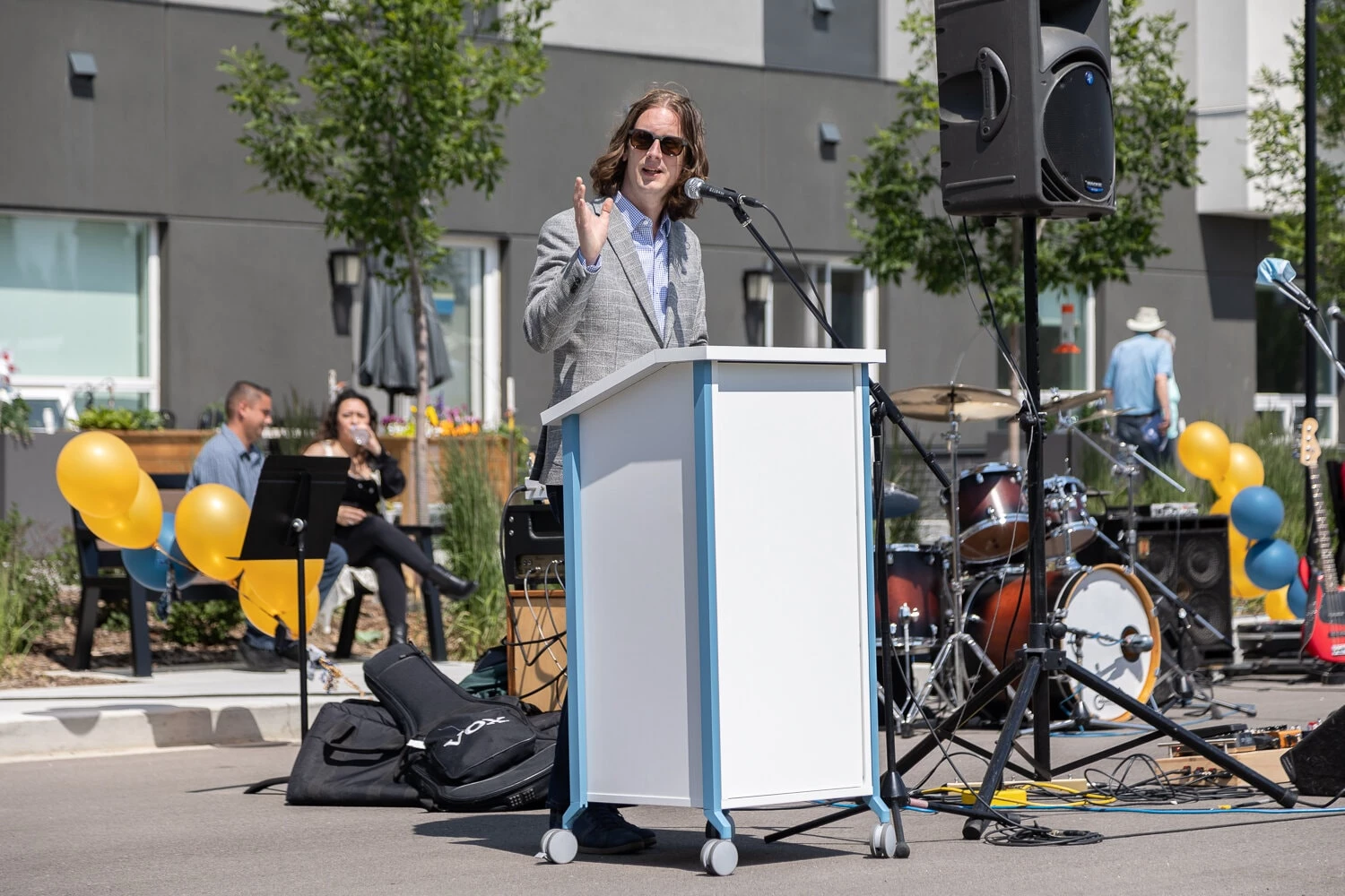 An man giving speech on Grand Opening ceremony at Aster Gardens