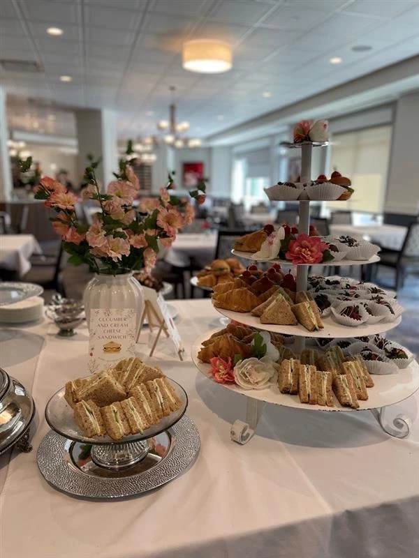 Platters of delicacies prepared on a table for residents to enjoy.