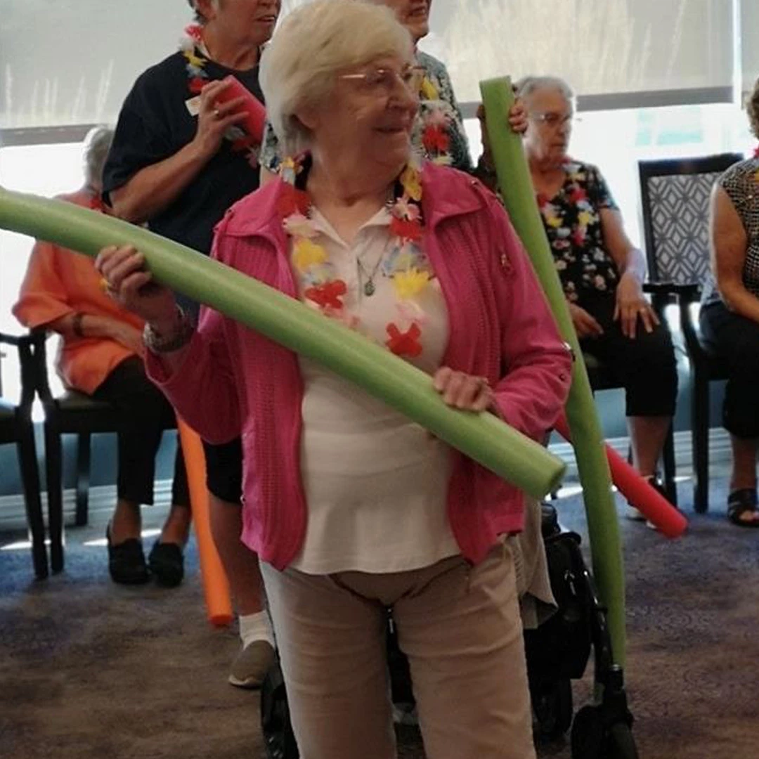 A gathering of senior citizens enjoying at the beach party