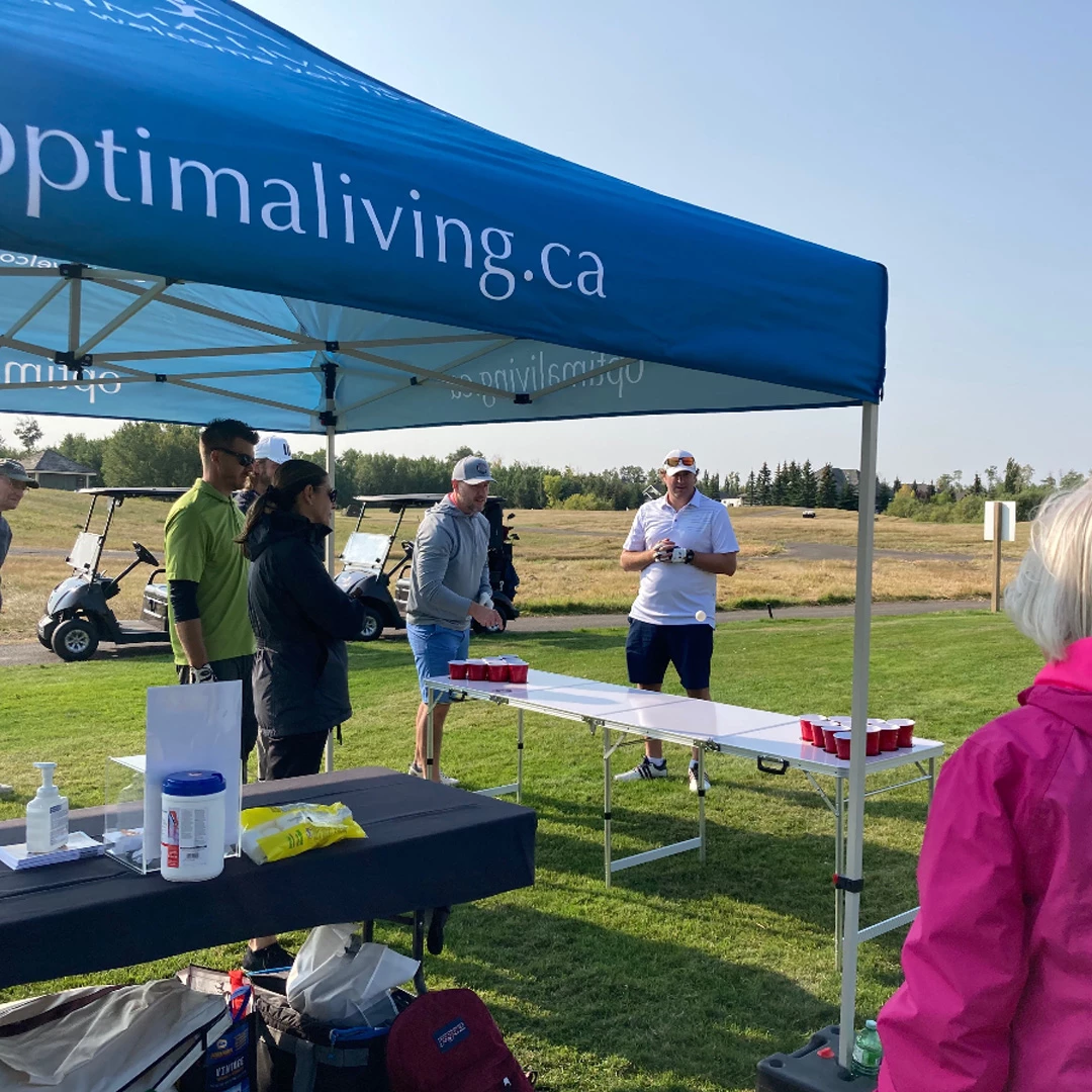 Optima living booth and some people playing games