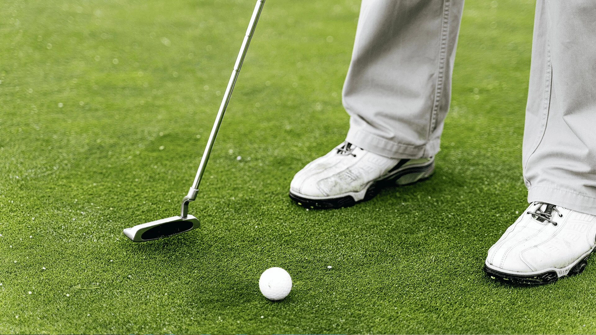 An elderly man playing golf at Aster Gardens